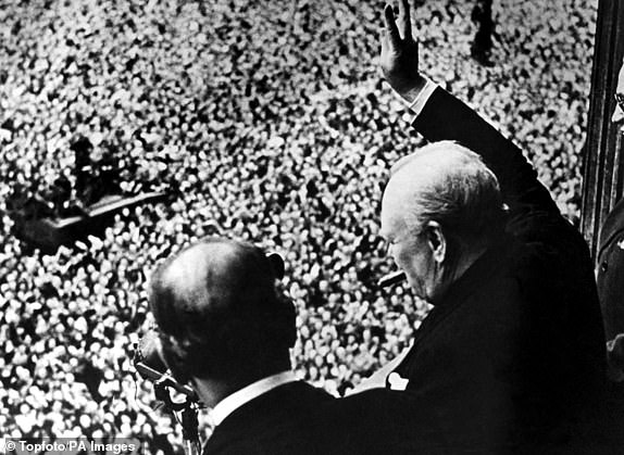 Prime Minister Winston Churchill gives his famous V for Victory sign to a crowd of 50,000 full with the spirit of VE day from the balcony of the Ministry of Health, London 8th May 1945