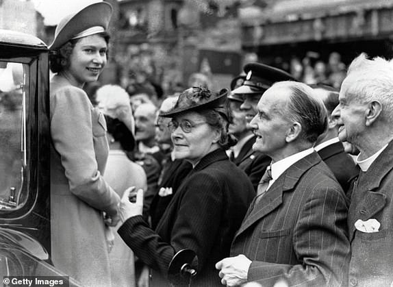 9th May 1945:  Princess Elizabeth is greeted by crowds as she tours the East End of London on the day after VE Day.  (Photo by Chris Ware/Keystone/Getty Images)