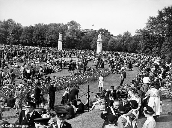 VE Day celebrations in London at the end of the Second World War. Some of the huge crowd gathered near Canada Gate at Green Park near Buckingham Palace for the celebrations. 8th May 1945. (Photo by Nixon & Greaves/Mirrorpix/Getty Images)