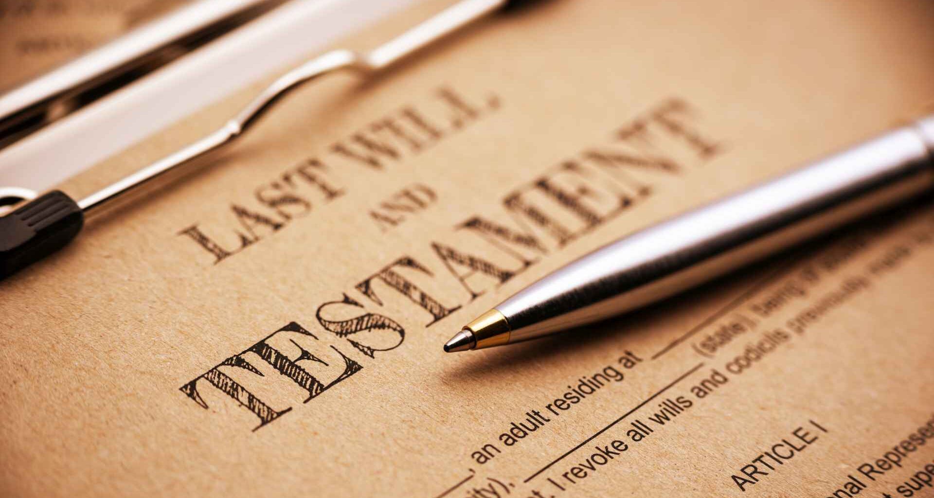 Vintage / retro style : Blue ballpoint pen and a last will and testament on a clip board.