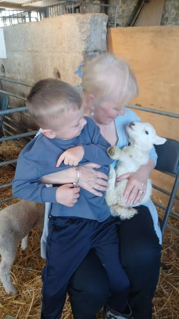 Michael with his grandmother Margaret at the farm