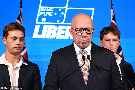BRISBANE, AUSTRALIA - MAY 03: Opposition Leader Peter Dutton concedes defeat alongside his sons Harry and Tom during a Liberal Party election night event at W Hotel on May 03, 2025 in Brisbane, Australia. Anthony Albanese and the Labor Party secure a second term as Australians rejected Peter Dutton's pitch for a conservative shift amid persistent cost-of-living and housing concerns. Dutton's defeat marks a setback for the Liberal-National coalition, reflecting shifting voter preferences. (Photo by Dan Peled/Getty Images)
