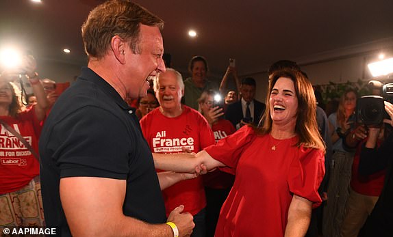 Ali France of Labor (middle) celebrates with former Qld Premier Steven Miles and supporters at Kallangur Bowls club, Saturday, May 3, 2025. (AAP Image/Jono Searle) NO ARCHIVING