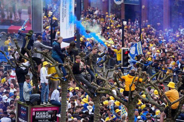 Leeds United fans lining the parade route in the city centre before the Sky Bet Championship trophy parade in Leeds. Leeds United beat Burnley to the title on Saturday. 