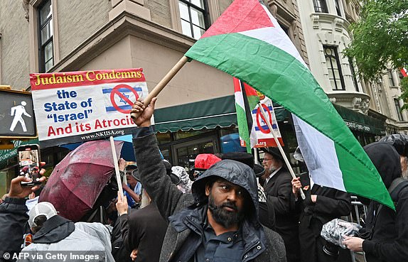 A small crowd of pro-Palestinian protesters gather outside the Met before the 2025 Met Gala at the Metropolitan Museum of Art on May 5, 2025, in New York. The Gala raises money for the Metropolitan Museum of Art's Costume Institute. The 2025 Met Gala is themed "Tailored for You," aligning with the Costume Institute's exhibition, "Superfine: Tailoring Black Style," set to open to the public on May 10. (Photo by Andrea RENAULT / AFP) (Photo by ANDREA RENAULT/AFP via Getty Images)
