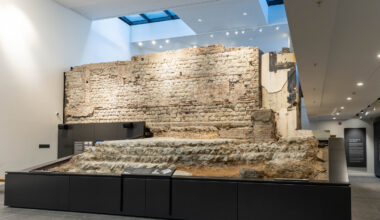 A section of a Roman wall inside of a building.