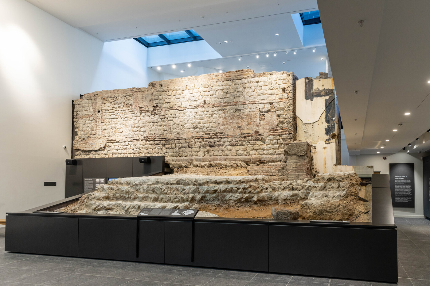 A section of a Roman wall inside of a building.