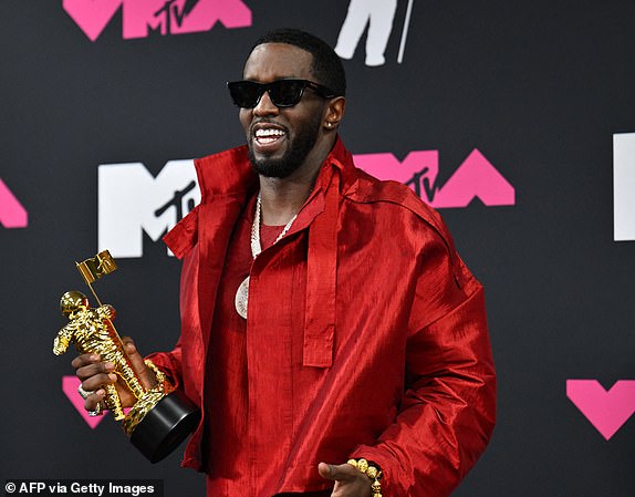 (FILES) US producer-musician Sean "Diddy" Combs poses with the Global Icon award in the press room during the MTV Video Music Awards at the Prudential Center in Newark, New Jersey, on September 12, 2023. Jury selection is set to begin May 5, 2025, in the blockbuster trial of Combs, the music mogul whose star fell dramatically following his incarceration on charges of sex trafficking and racketeering. Combs, 55, has been awaiting trial since last fall on accusations of leading a crime ring that prosecutors say perpetrated systemic sexual abuse and coerced victims into drug-fueled sex parties using threats and violence. (Photo by ANGELA WEISS / AFP) (Photo by ANGELA WEISS/AFP via Getty Images)