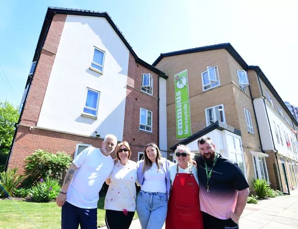 Katie Foster (Head of Operations) centre, at Emmaus Merseyside, at the Community Home in Seaforth, with ltr Companion Stewart Woods, volunteers Linda Adkins, Janet Hopwood and Lewis Millar (Support Worker).
