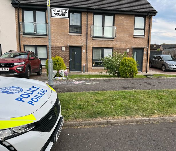 Flowers have been left outside the home in Nitshill
