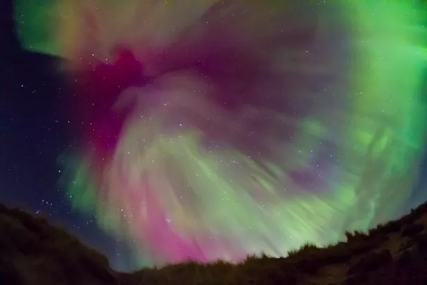 Amazing aurora burst over the hills in Caithness, Scotland