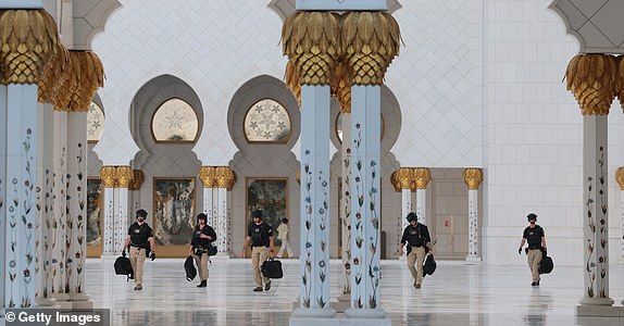 ABU DHABI, UNITED ARAB EMIRATES - MAY 15:  US Secret Service counter assault team walk through the mosque as U.S. President Donald J. Trump tours the Sheikh Zayed Grand Mosque, May 15, 2025, in Abu Dhabi, United Arab Emirates. Trump is on the third day of his visit to the Gulf to underscore the strategic partnership between the United States and regional allies including the UAE, focusing on security and economic collaboration. (Photo by Win McNamee/Getty Images)
