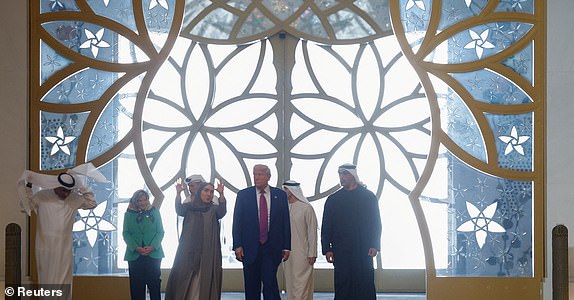 U.S. President Donald Trump tours the Sheikh Zayed Grand Mosque with Yousif Al Obaidli, the mosque's director, Crown Prince of Abu Dhabi Khaldoon Khalifa and Ameena Al Hammadi, acting director of the Culture and Knowledge Department, during a visit to Abu Dhabi, United Arab Emirates, May 15, 2025. REUTERS/Brian Snyder