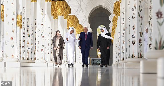President Donald Trump and Sheikh Khaled Mohammed bin Zayed Al Nahyan, Crown Prince of Abu Dhabi, right, tour the Sheikh Zayed Grand Mosque, Thursday, May 15, 2025, in Abu Dhabi, United Arab Emirates. (AP Photo/Alex Brandon)