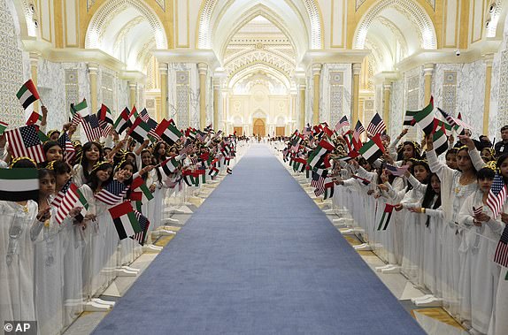 Children prepare to greet President Donald Trump and UAE President Mohammed bin Zayed Al Nahyan as they for a State Dinner at Qasr Al Watan, Thursday, May 15, 2025, in Abu Dhabi, United Arab Emirates. (AP Photo/Alex Brandon)