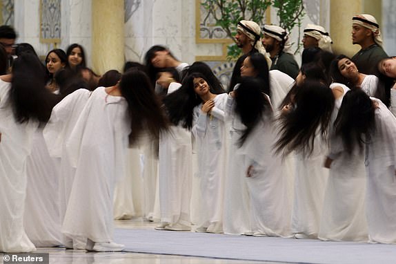 Children perform a traditional dance, on the day U.S. President Donald Trump meets United Arab Emirates President Sheikh Mohamed bin Zayed Al Nahyan, at Qasr Al Watan, in Abu Dhabi, United Arab Emirates, May 15, 2025. REUTERS/Amr Alfiky