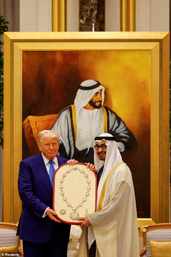 U.S. President Donald Trump receives the Order of Zayed medal from United Arab Emirates President Sheikh Mohamed bin Zayed Al Nahyan at Qasr Al Watan, in Abu Dhabi, United Arab Emirates, May 15, 2025. REUTERS/Brian Snyder
