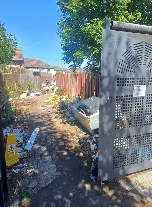 Piled up alleyway rubbish in Bootle