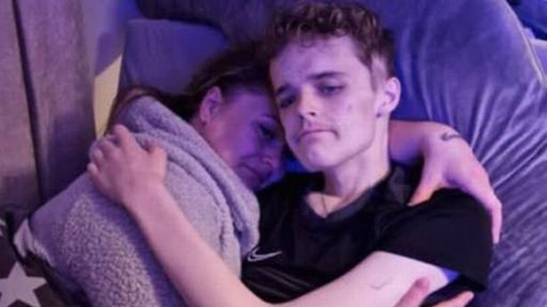 Brave Rhys Russell hugging his mum Lauren 