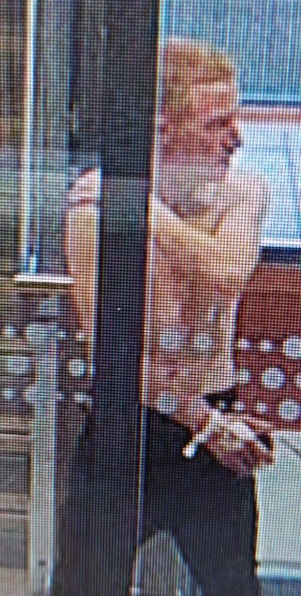 A CCTV image of Thomas who has ginger hair and is pictured without a top in and is said to be wearing wearing black trousers and white trainers