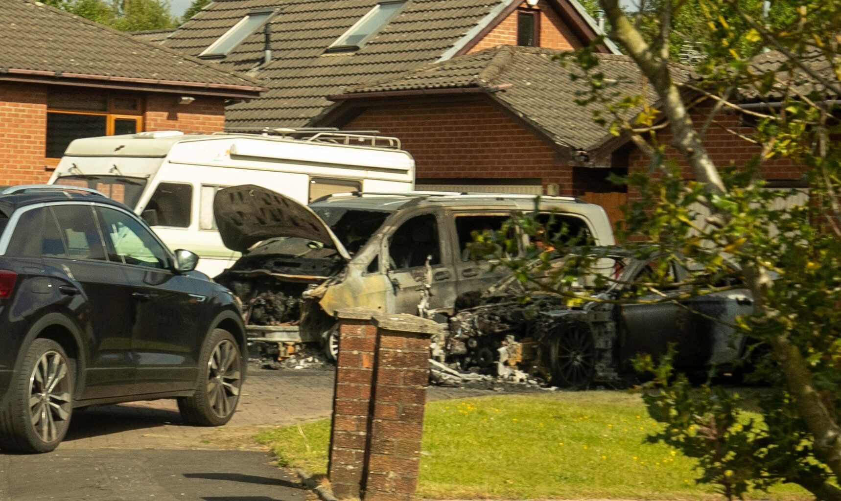 Two cars left burned out at home of former Glasgow taxi firm boss