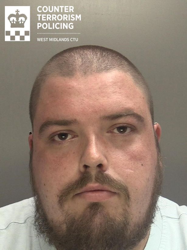 Police custody image of Richard Britton, 31, from Wombourne, who is white with shaved brown hair and a beard
