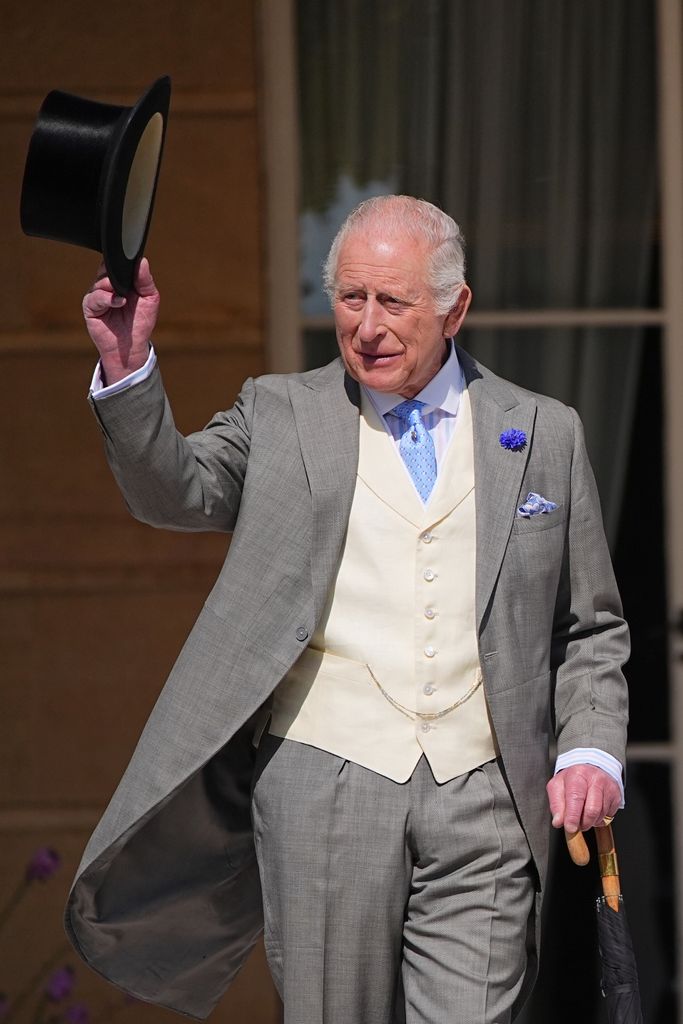 King Charles tipping his top hat