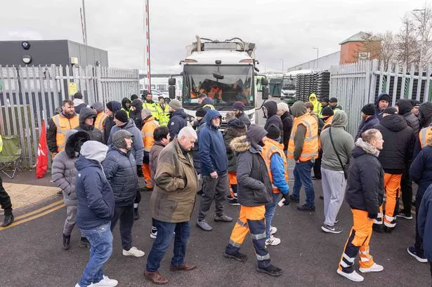 Striking bin men walked in front of bin lorries leaving Birmingham City Council's depot in Redfern Road in Tyseley