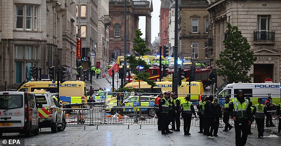epa12137713 The scene where a car collided with Liverpool supporters during the trophy parade in Liverpool city centre, Britain, 26 May 2025. A man has been detained after the collision with a number of pedestrians during Liverpool FC's victory parade, Merseyside Police said.  EPA/ADAM VAUGHAN