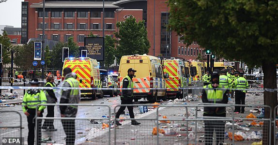epaselect epa12137424 The scene where a car collided with Liverpool supporters during the trophy parade in Liverpool city centre, Britain, 26 May 2025. A man has been detained after the collision with a number of pedestrians during Liverpool FC's victory parade, Merseyside Police said.  EPA/ADAM VAUGHAN