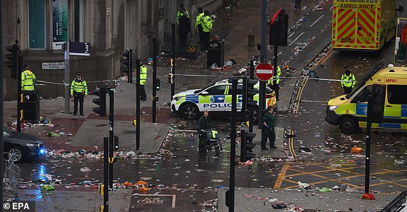 epa12137531 The scene where a car collided with Liverpool supporters during the trophy parade in Liverpool city centre, Britain, 26 May 2025. A man has been detained after the collision with a number of pedestrians during Liverpool FC's victory parade, Merseyside Police said.  EPA/ADAM VAUGHAN