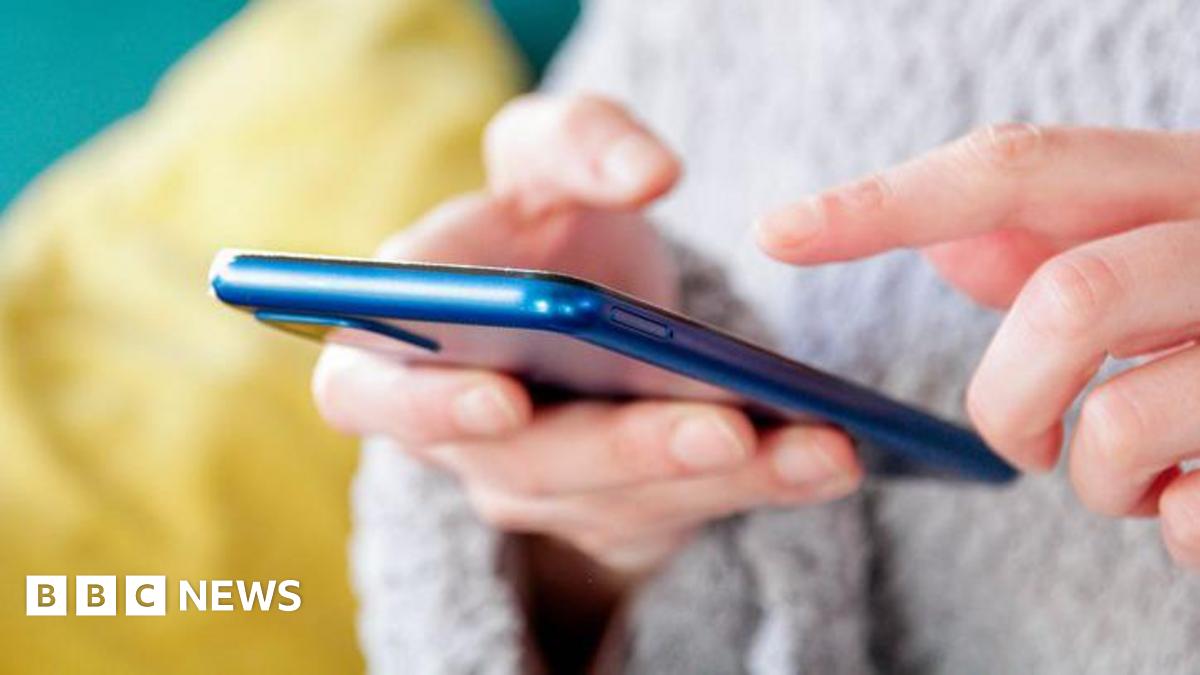 A stock image of someone texting on a mobile phone.