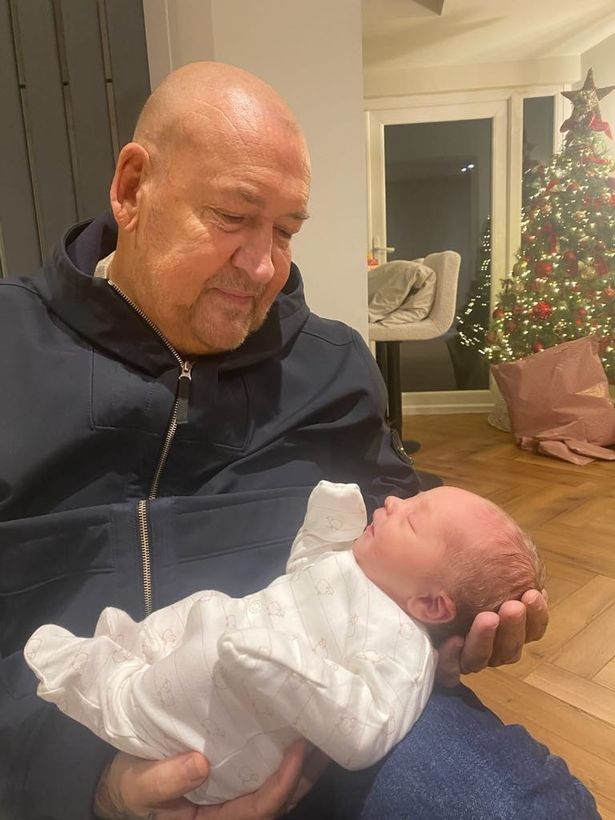 Grandad Conrad Jones with his granddaughter Olive