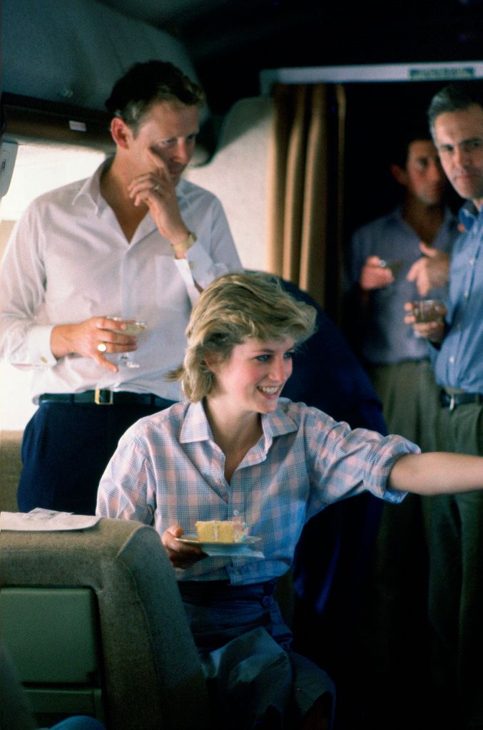 Prince Charles and Princess Diana on board a Royal Australian Air Force plane refuelling in Fiji before continuing to Australia, with their staff commander Brian Robertson (the Australian equerry to Prince Charles for the royal tour) and Sir John Riddell (the prince's private secretary)