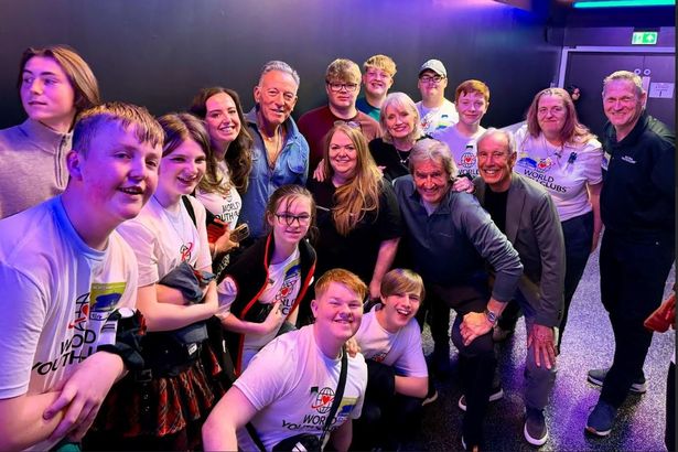 Members of Salord Lads and Girls Club meet Bruce Springsteen backstage before his concert at Co-Op Live on May 17th.