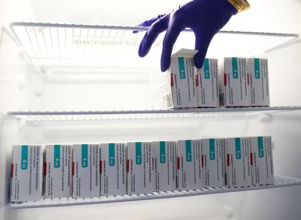 Vials of the Oxford/AstraZeneca coronavirus vaccine are stored in a temperature-controlled fridge