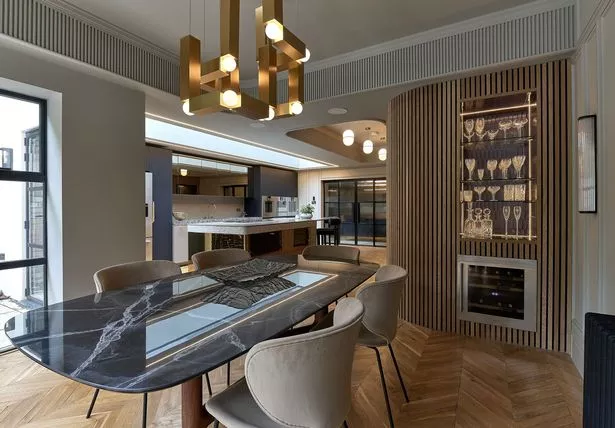 The kitchen design ensured that the ceiling had visual interest but practical elements too, such as the plaster detailing on the boxed in steel beams