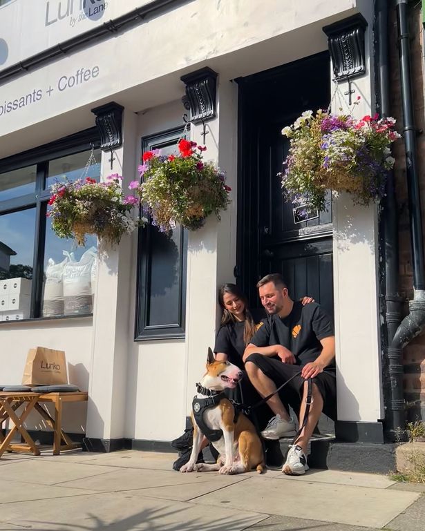 Adelina Blanaru and Marius Dogaru with their English Bull Terrier Torsten outside Lunko, just off Lark Lane
