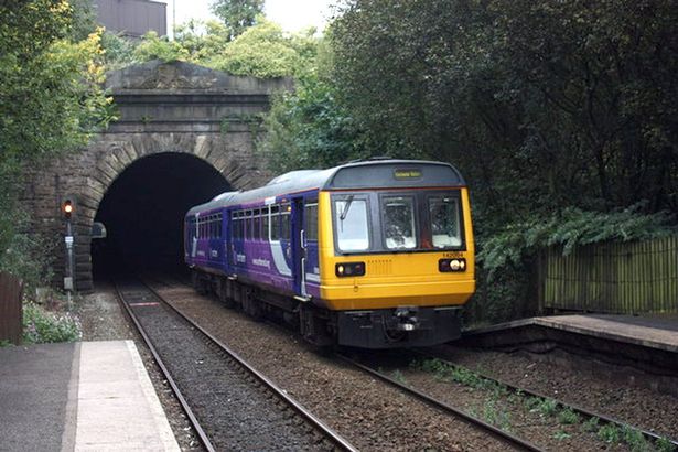Class 142 train emerges from tunnel at Oldham Werneth in 2009