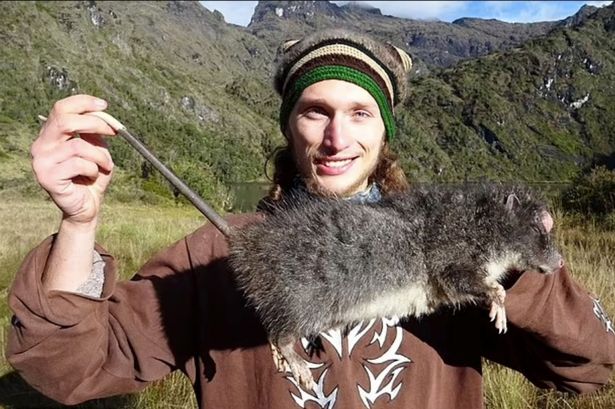A scientist has discovered a whopping species of rat that measures more than two-and-a-half feet. The proud discoverer František Vejmělka is pictured with the giant rat in its natural habitat 