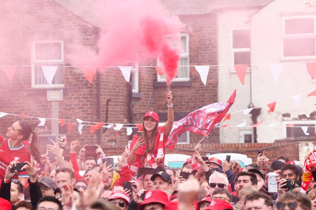 Liverpool fans celebrate winning the Premier League at The Sandon near Anfield stadium after their their match v Crystal Palace
