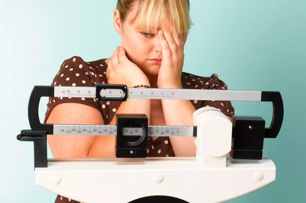 teenager on scales concerned the result