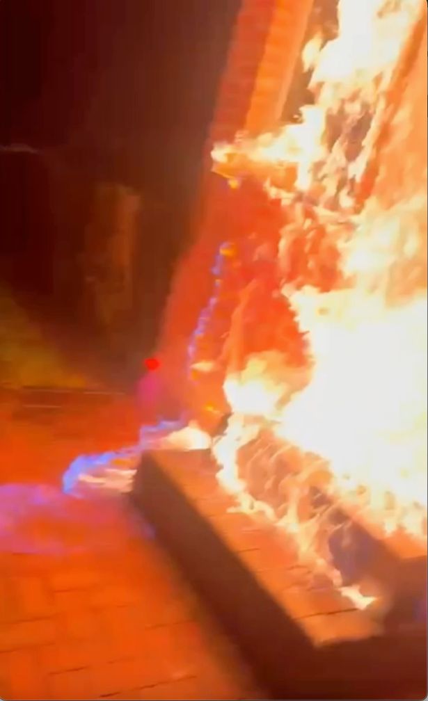 The door and the home was quickly engulfed in flames
