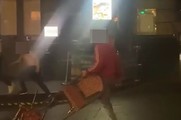 The man appeared to be holding a chair during an altercation.