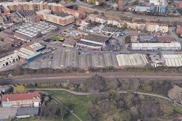 The location of a proposed development on Princess Street in Bedminster, as seen from above Victoria Park. St Mary Redcliffe primary school is in the bottom left, and the development area is immediately above of the railway line - the grey-roofed industrial buildings in between white buildings on either side.