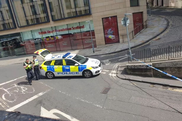 Police could be seen at the top of Calton Road.