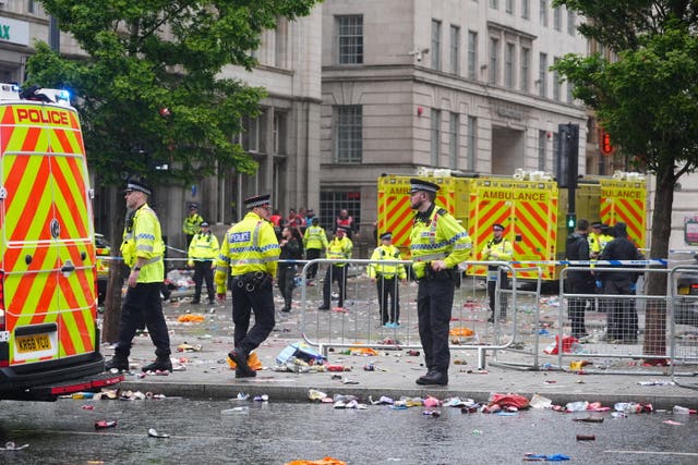 Police and emergency personnel at the cordon 