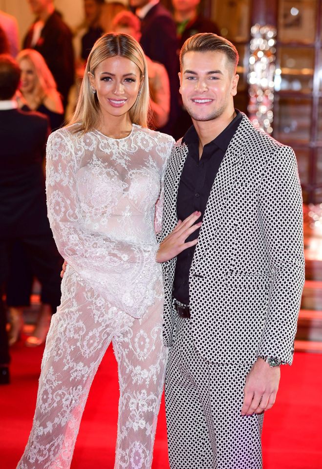 Olivia Attwood and Chris Hughes on a red carpet.