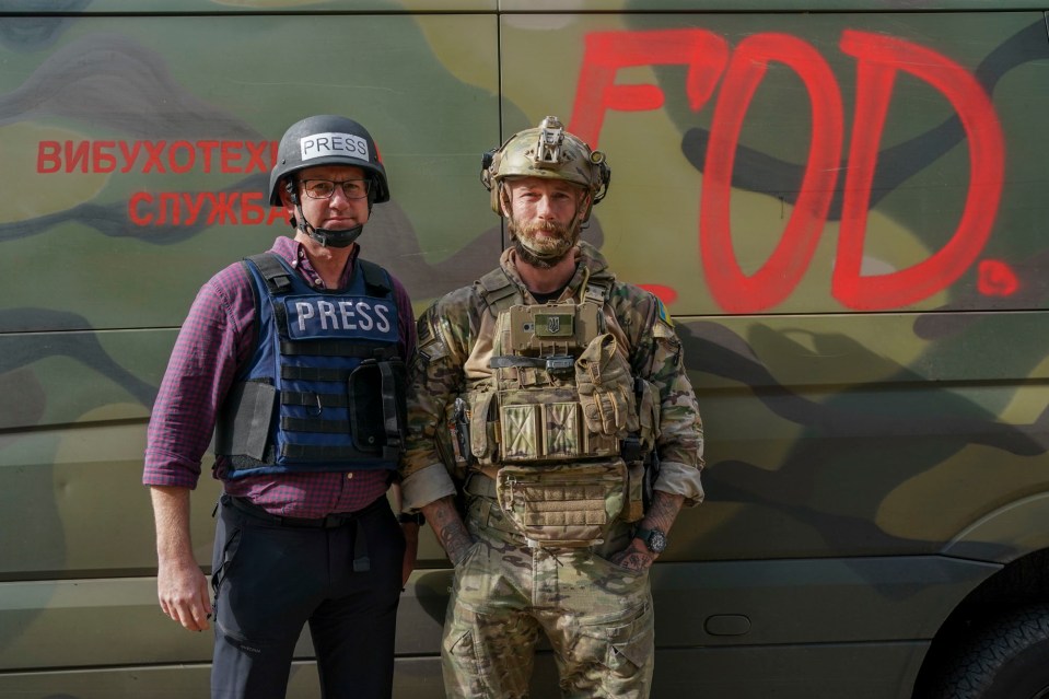 British bomb disposal expert with a journalist.