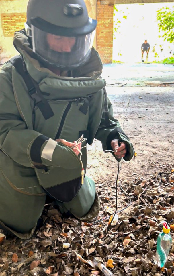 British bomb disposal expert disarming a device.